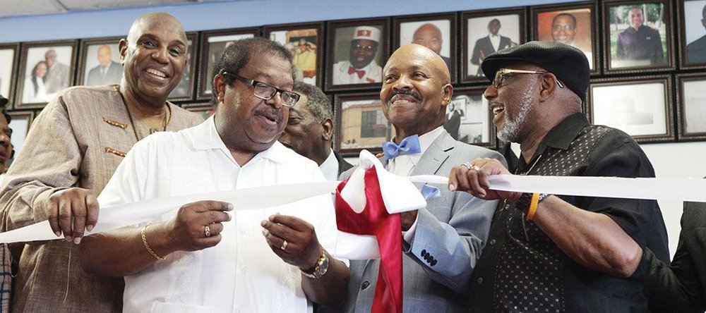 Rev. Timothy McDonald (second from left) and Student Minister Sharrieff Muhammad (second from right) prepare for ribbon cutting at Blue Seas Express & Catering in Atlanta, a joint economic partnership between Muslims and Christians.